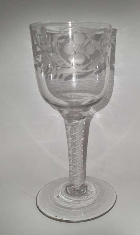 18th Century English engraved bowl glass with air-twist stem and white twist stem.