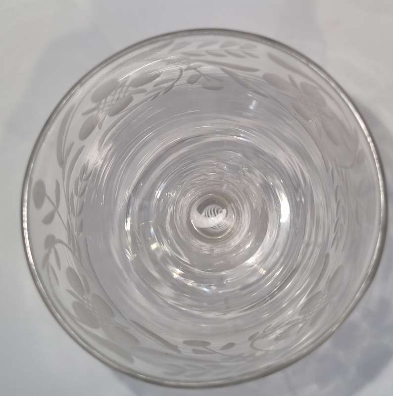 18th Century English engraved bowl glass with air-twist stem and white twist stem.