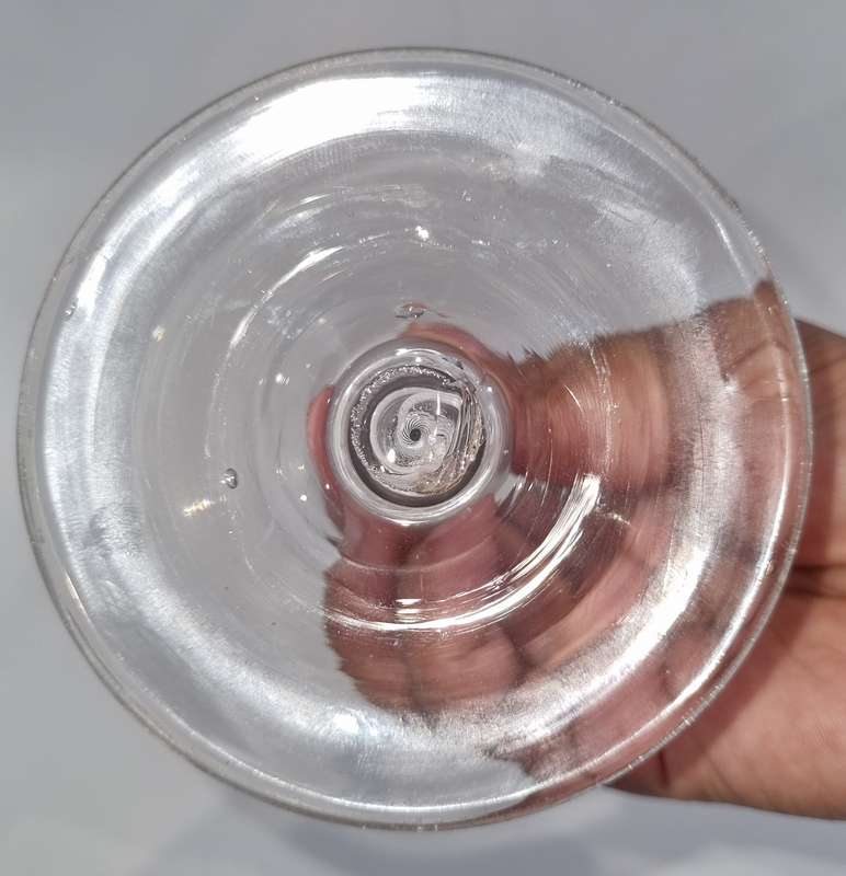 18th Century English engraved bowl glass with air-twist stem and white twist stem.