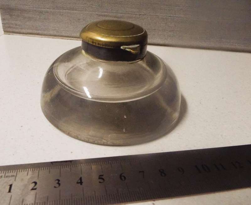 very rare Antique round glass inkwell 10cm round 5cm tall , brass cap  2.5cm