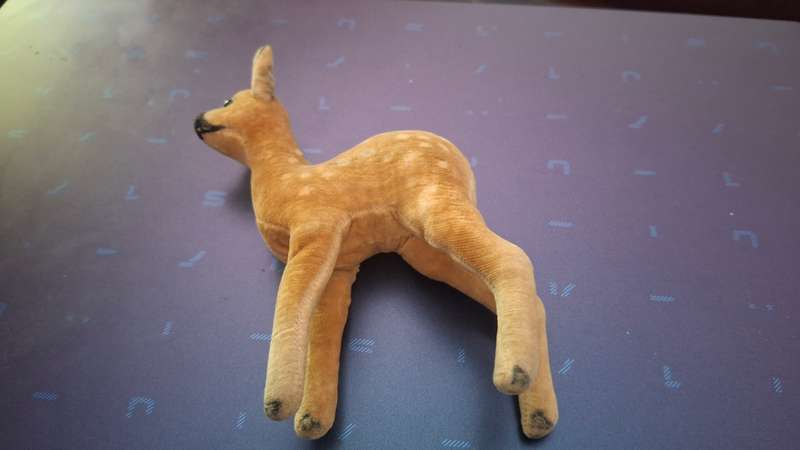 Small soft toy fawn, unmarked, in the style of Steiff circa 1950 with glass eyes, stitched nose