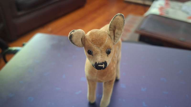 Small soft toy fawn, unmarked, in the style of Steiff circa 1950 with glass eyes, stitched nose