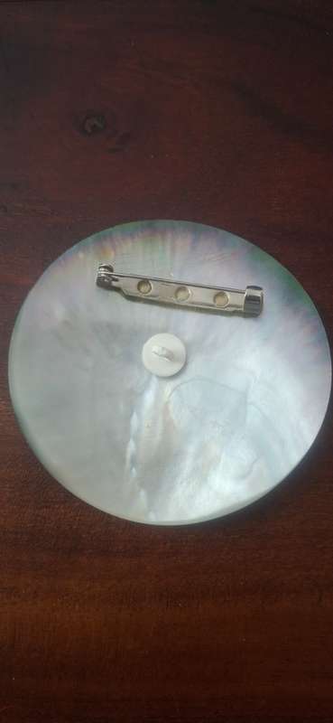 Black shell brooch