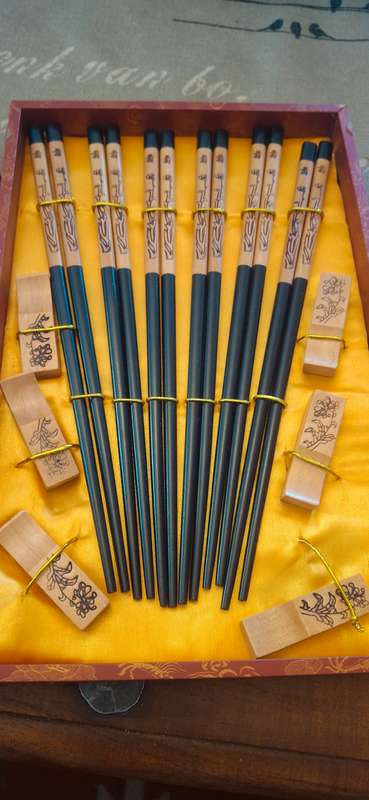 Vintage wooden chopsticks with rests in wooden box