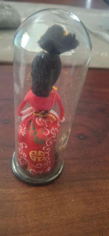 Small Chinese doll in dome