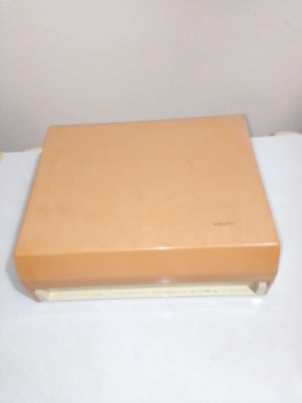 Orange and White Krups fold away wall hanging scale 1.5 to 3kg.