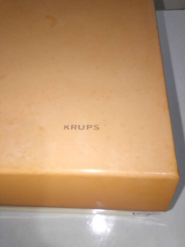 Orange and White Krups fold away wall hanging scale 1.5 to 3kg.