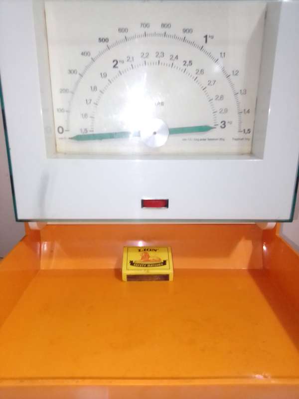 Orange and White Krups fold away wall hanging scale 1.5 to 3kg.