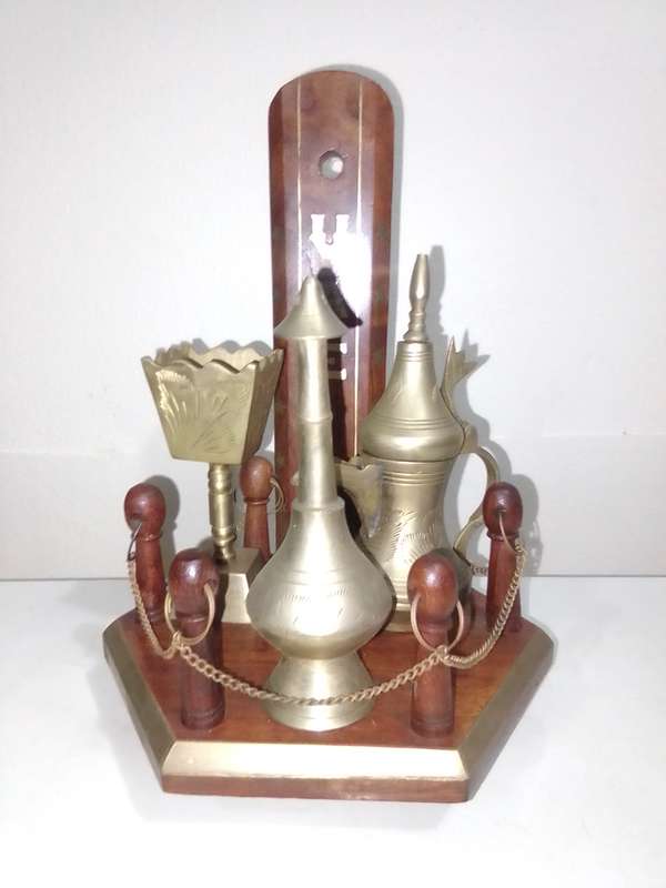 Wow a collection of Incense burners on wooden stand.