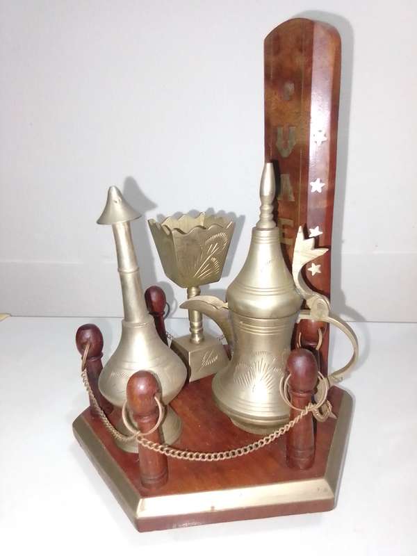 Wow a collection of Incense burners on wooden stand.