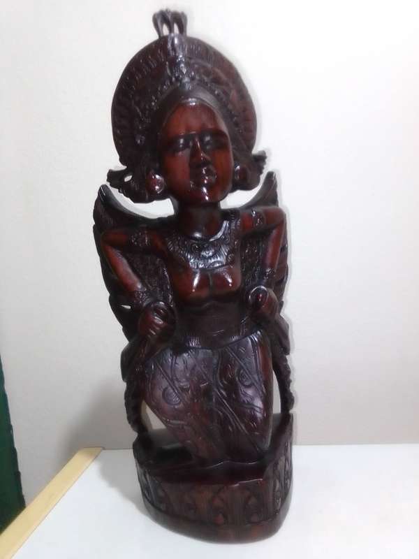 A "Bali, Indonesia, Bust Circa 1930-1940" kneeling in respect representing a Janger Dancer in Teak.