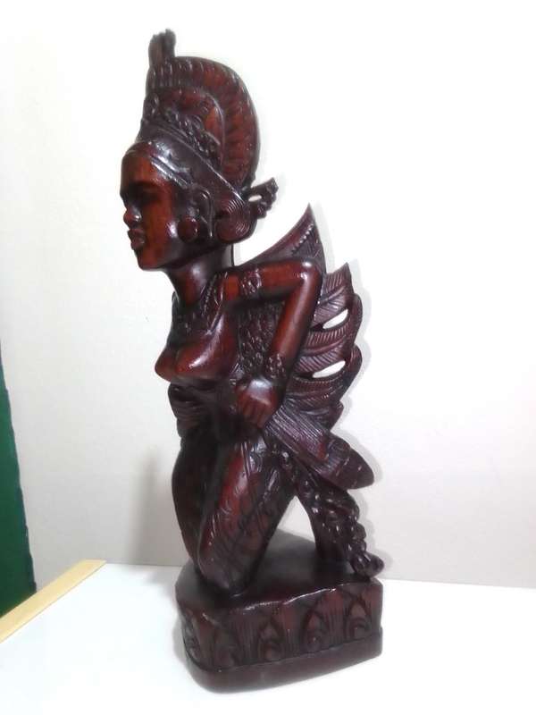 A "Bali, Indonesia, Bust Circa 1930-1940" kneeling in respect representing a Janger Dancer in Teak.