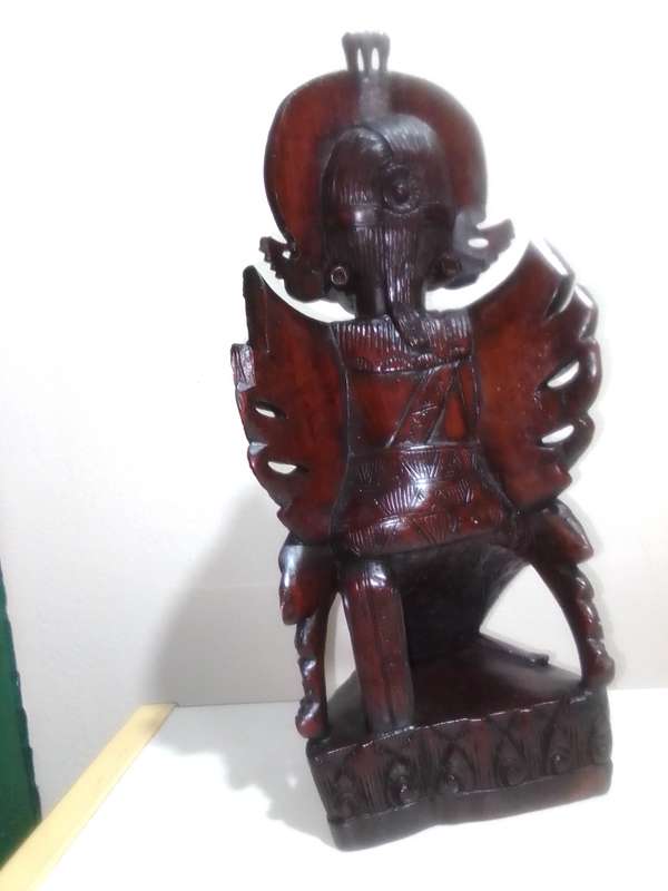 A "Bali, Indonesia, Bust Circa 1930-1940" kneeling in respect representing a Janger Dancer in Teak.