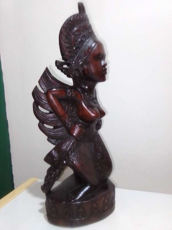 A "Bali, Indonesia, Bust Circa 1930-1940" kneeling in respect representing a Janger Dancer in Teak.