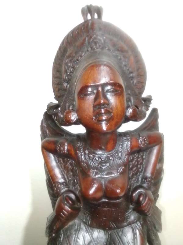 A "Bali, Indonesia, Bust Circa 1930-1940" kneeling in respect representing a Janger Dancer in Teak.