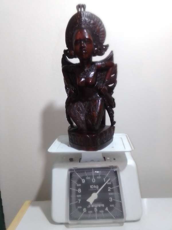 A "Bali, Indonesia, Bust Circa 1930-1940" kneeling in respect representing a Janger Dancer in Teak.