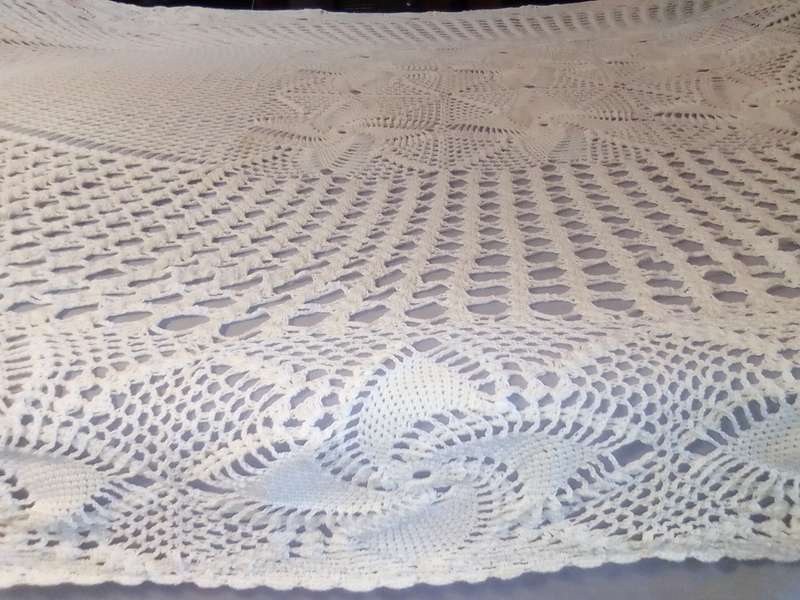 A extra large Hand Crocheted oblong/oval Tablecloth Size: 2.8mx1.7m in Excellent condition.