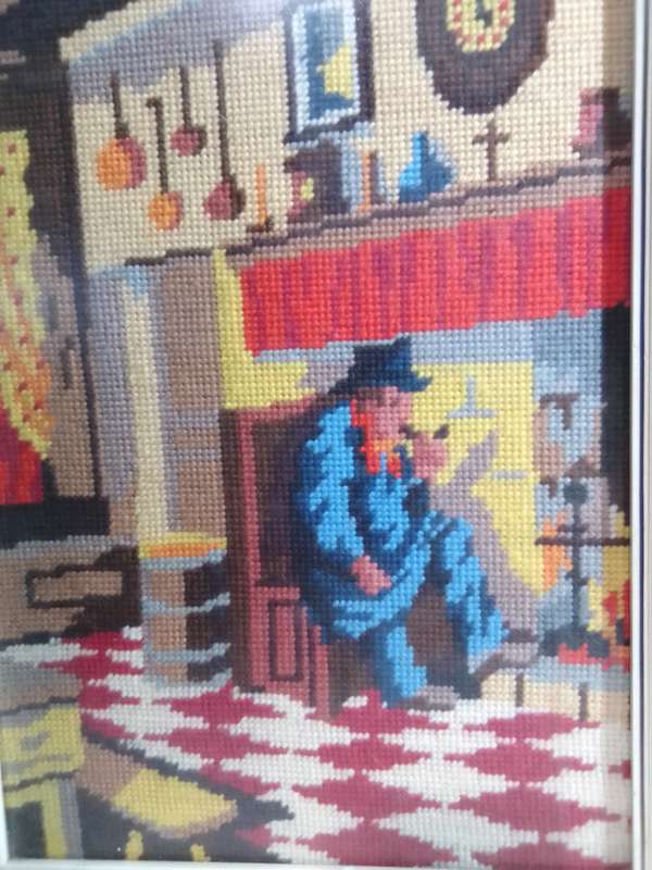 Great Needlepoint Tapestry Picture the Old Man smoking by fireside in a old Kitchen under glass.