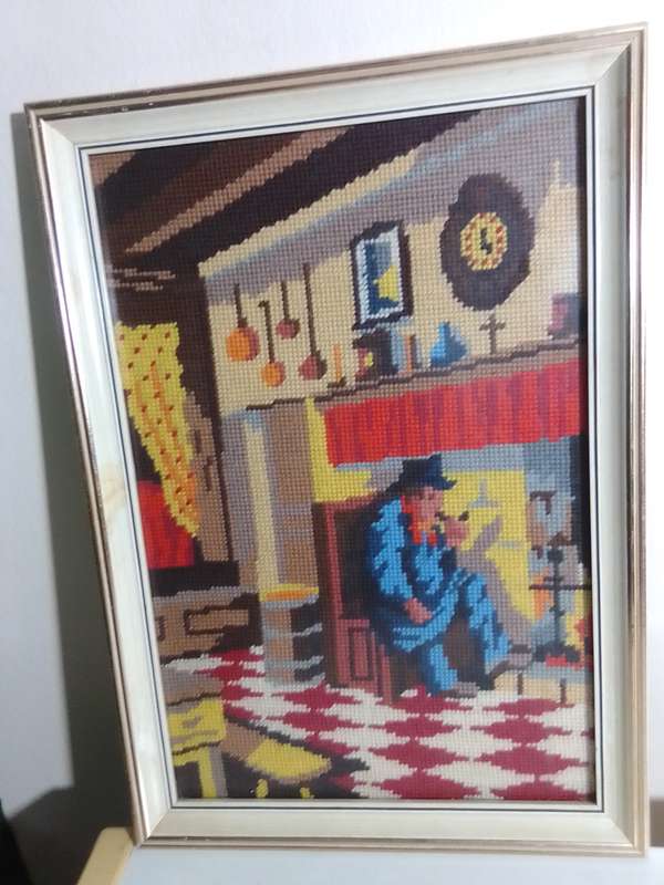 Great Needlepoint Tapestry Picture the Old Man smoking by fireside in a old Kitchen under glass.