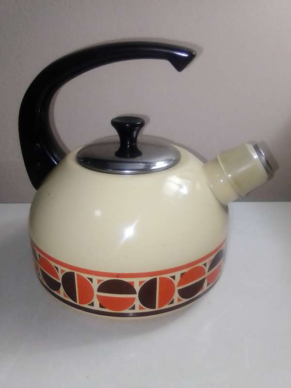 Fancy stove top whistling Kettle cream enamel with patons.