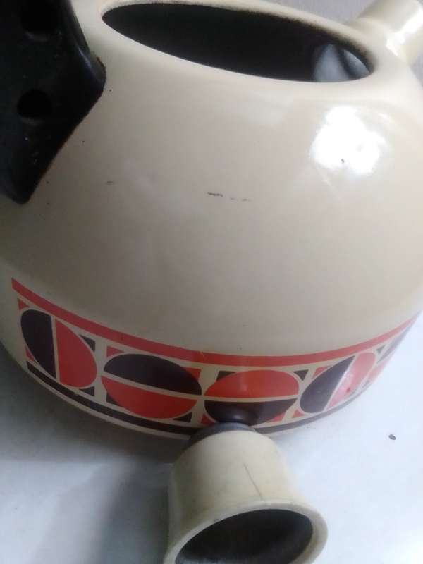 Fancy stove top whistling Kettle cream enamel with patons.