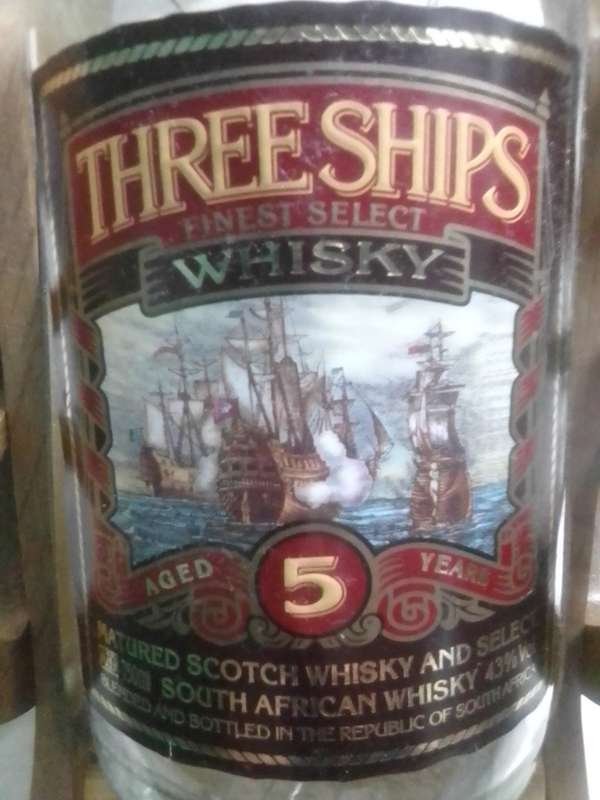 Vintage empty Three Ships 5 year old Scotch whisky  on Cannon framework.