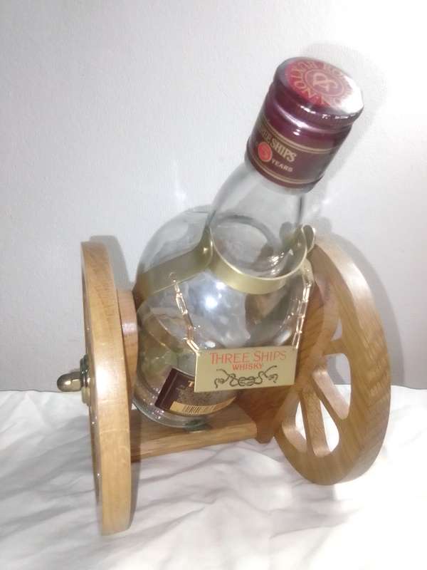 Vintage empty Three Ships 5 year old Scotch whisky  on Cannon framework.