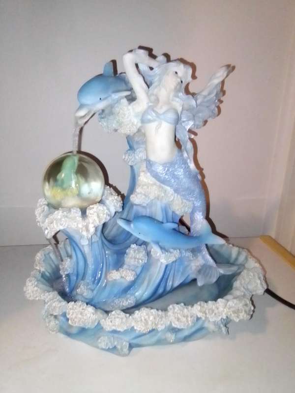 Mini Mermaid and 3 Dolphin's indoor fountain in polyresin and it's a working water display.