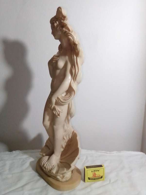 Vintage large nude Greek Lady in a shell. Stamped: A Santini on the shell. 42cm Tall