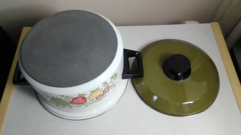 Vintage green lid veggies motif enamel cooking pot with heavy duty base.