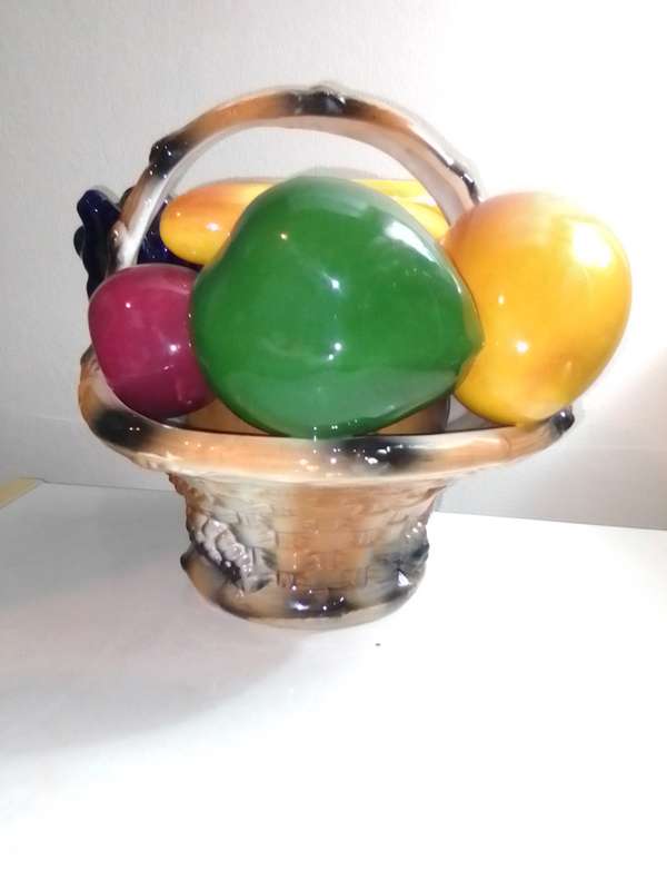 A ceramic decorative display Fruit basket marked B020 on the base.