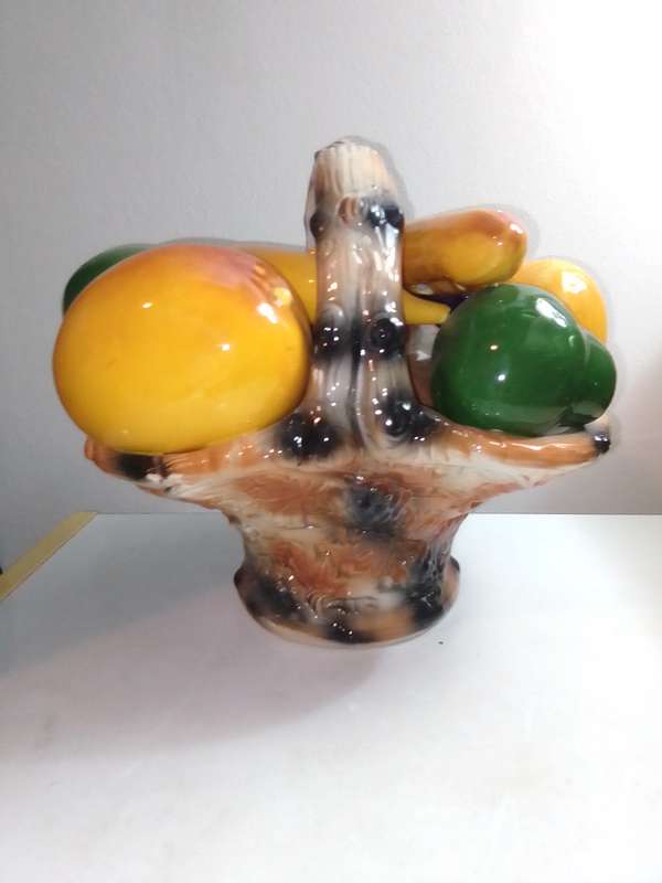 A ceramic decorative display Fruit basket marked B020 on the base.