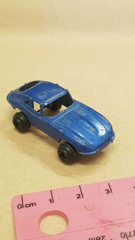 Two metal die cast toy cars. VW Bettle and e-type Jaguar.