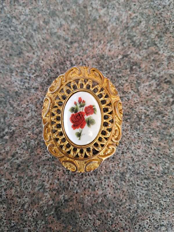 Vintage gold colored brooch with opel glass red rose design Germany
