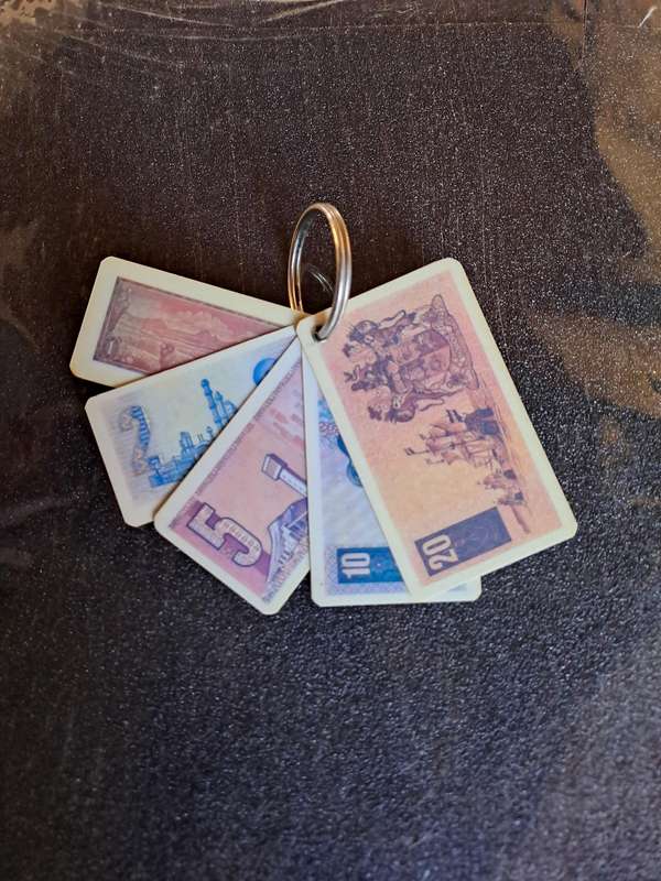 Vintage key ring showing old South African currency