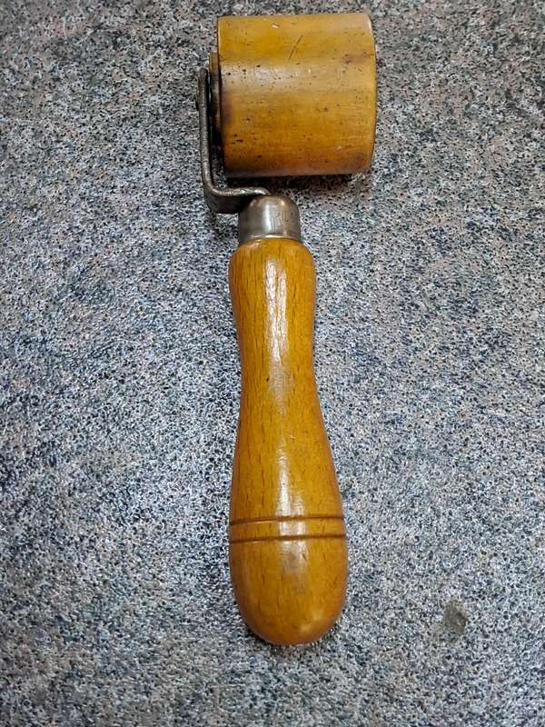 Vintage wooden seam roller for wallpaper made by Ridgely England