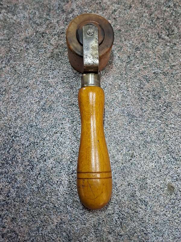 Vintage wooden seam roller for wallpaper made by Ridgely England