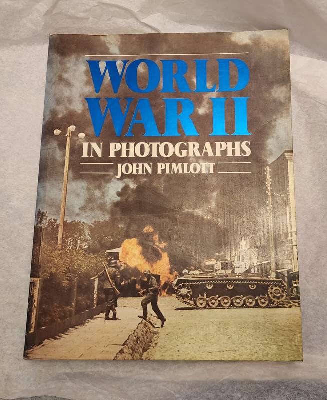 "World War II in Photographs" by John Pimlott- Fantastic book, a must have! Vintage War related Book