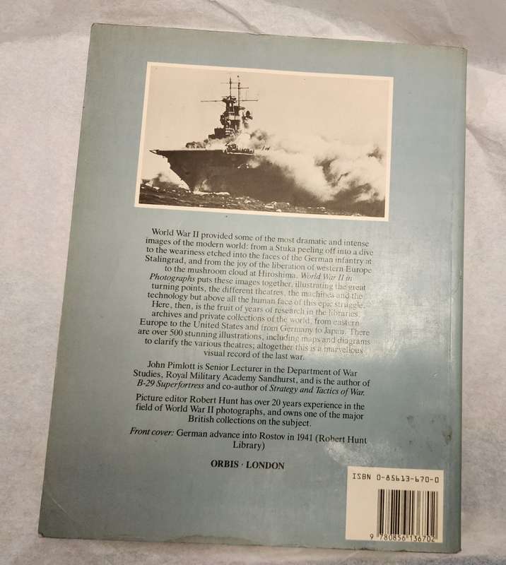 "World War II in Photographs" by John Pimlott- Fantastic book, a must have! Vintage War related Book