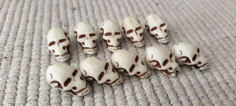 A Collection of 10 Ivory and Brown Acrylic Skull Beads. (B2)
