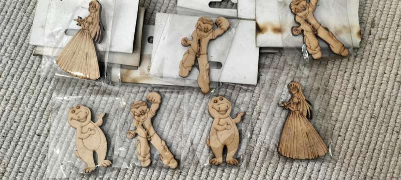 A Collection of 7 Scroll Saw Animated Action Figurine Cut Outs