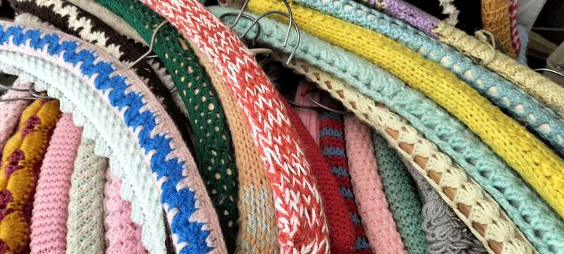 A Superb Collection of 58 Vintage Crochet/Knitting Covered Wooden Hangers