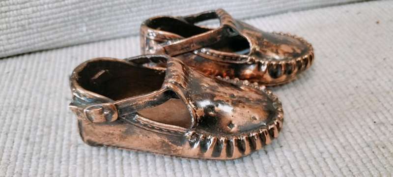 A Pair of Vintage Copper Plated Shoes