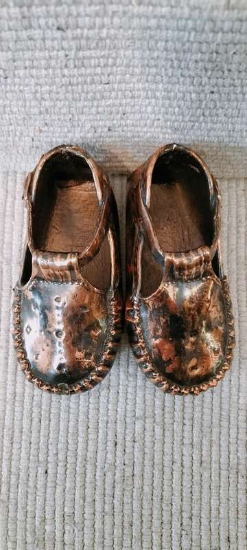 A Pair of Vintage Copper Plated Shoes