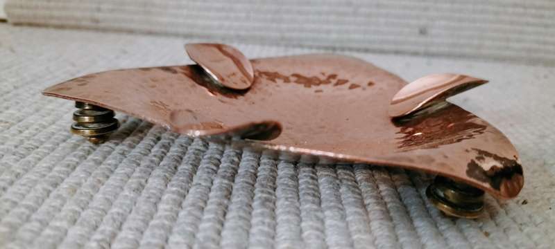 A Magnificent Mid Century Hammered Copper Ashtray with Feet