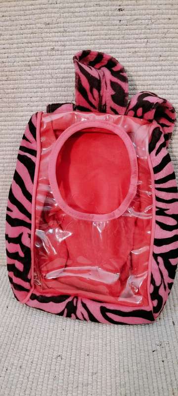 A Small Unique Childs Back Pack With Opening On Back
