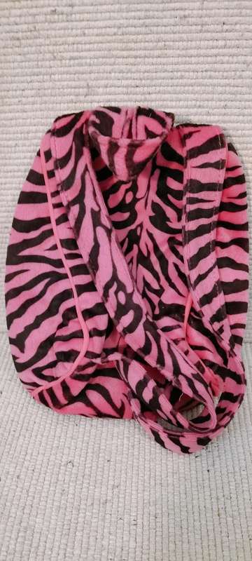 A Small Unique Childs Back Pack With Opening On Back