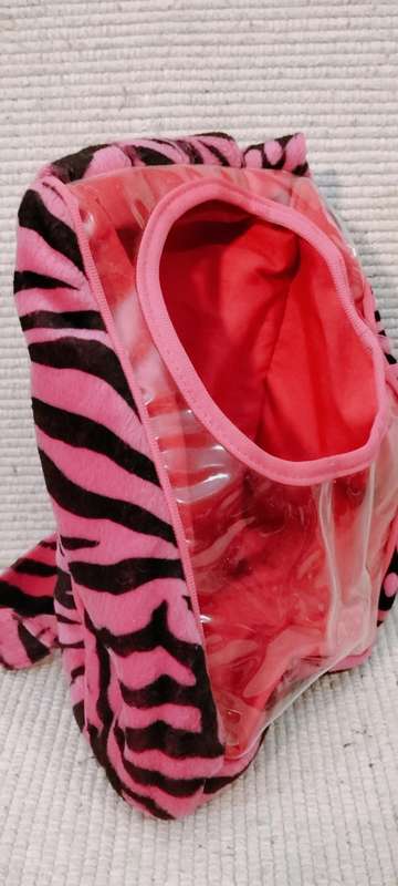 A Small Unique Childs Back Pack With Opening On Back