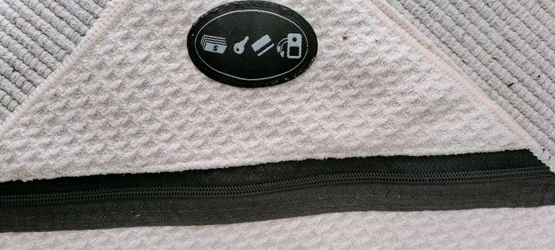 A Gym Face Towel with Zip Pocket for Keys/Phone