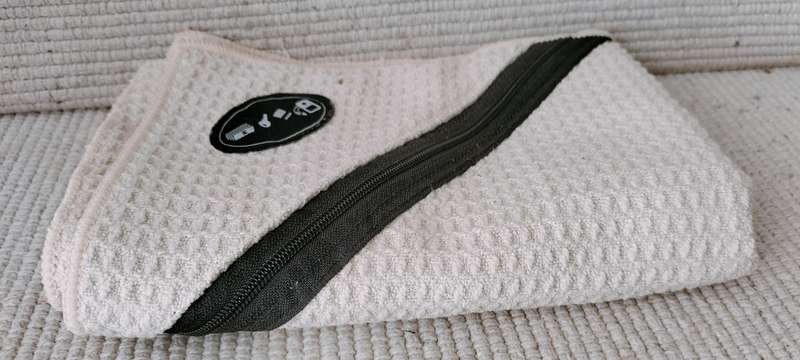 A Gym Face Towel with Zip Pocket for Keys/Phone